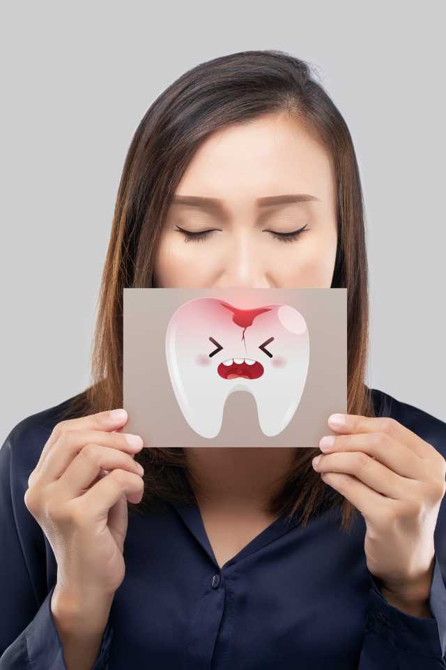 Czy próchnica jest zaraźliwa? - kobieta z próchnicą zębów